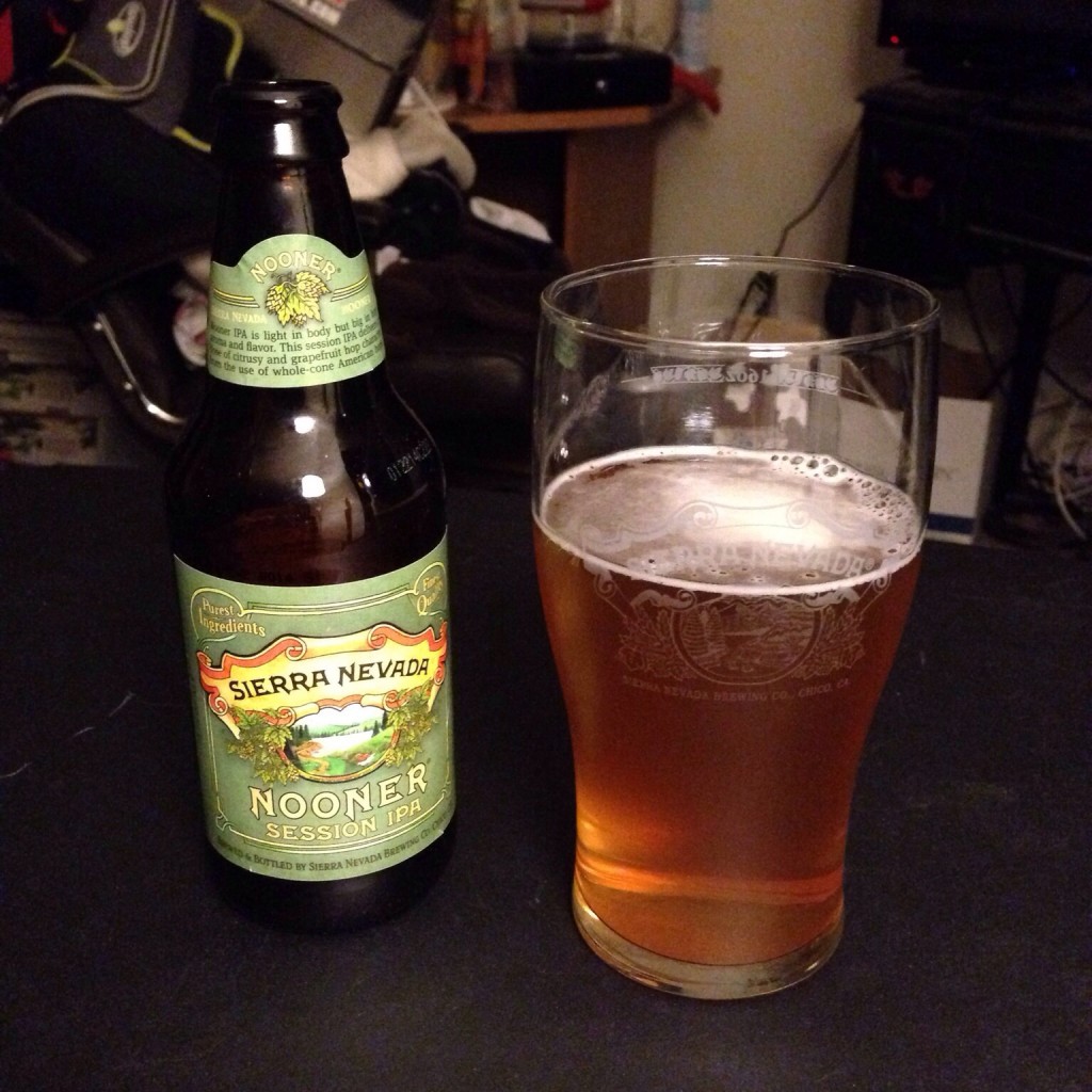 A bottle of Sierra Nevada Nooner Session IPA is on display next to a glass of the ale.