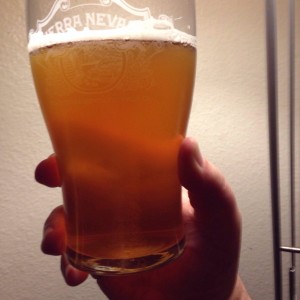 Sierra Nevada Nooner Session IPA looks amber and coppery when it is held to the light.